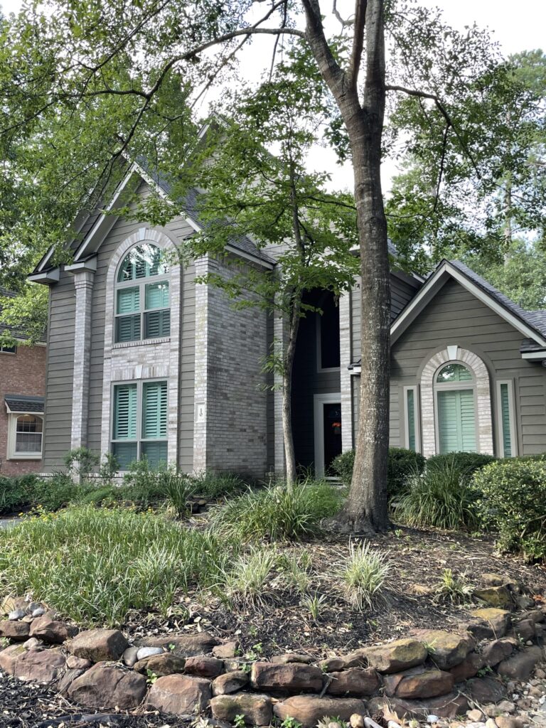 Champion Forest Exteriors team working on a home in a Houston neighborhood showcasing decades of trusted local remodeling experience.