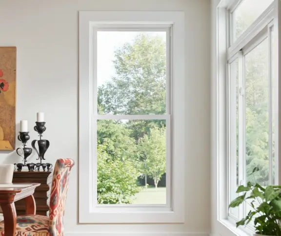 Champion Forest Exteriors installing storm-ready windows and siding designed to protect homes during heavy rain and severe weather.