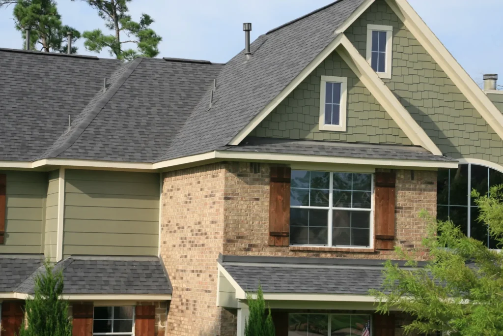 Champion Forest Exteriors consultant providing a homeowner with expert guidance on siding and exterior design for long-lasting performance and curb appeal.