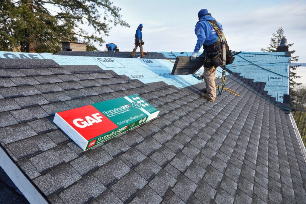 Champion Forest Exteriors installing GAF Timberline shingles on a residential home providing durable weather-resistant roofing with long-term performance.