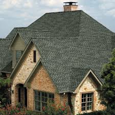 Champion Forest Exteriors installing a complete GAF roofing system including underlayment shingles and ridge vents for full roof protection.