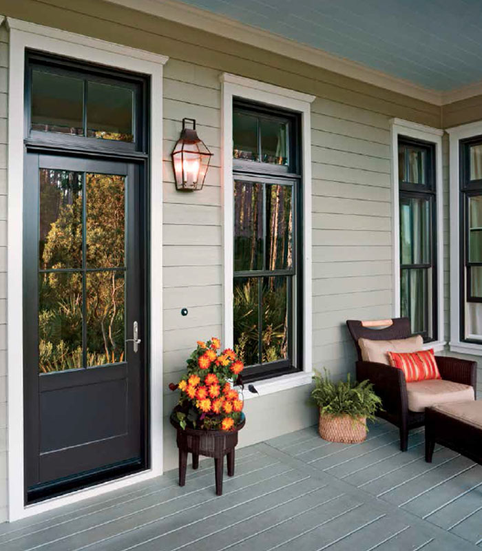 Champion Forest Exteriors installing high performance fiber cement siding on a residential home for maximum durability and weather resistance.