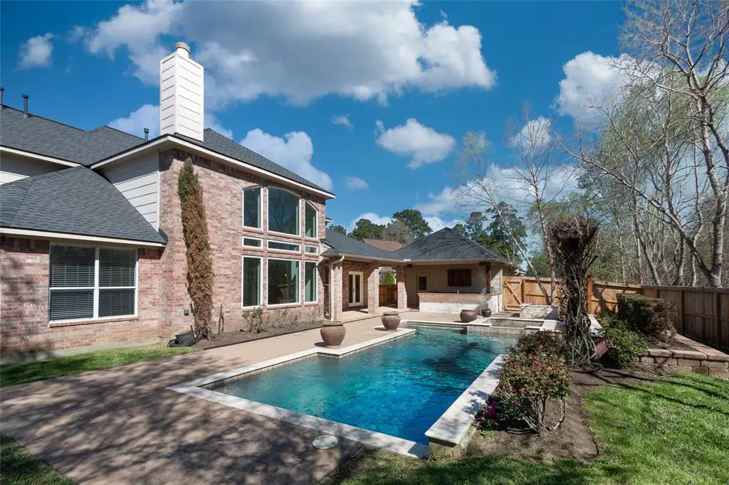 Champion Forest Exteriors team standing in front of a Houston-area home showcasing their commitment to the local community.