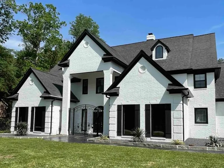 Champion Forest Exteriors consultant meeting with a homeowner to review premium exterior materials and discuss personalized service options.