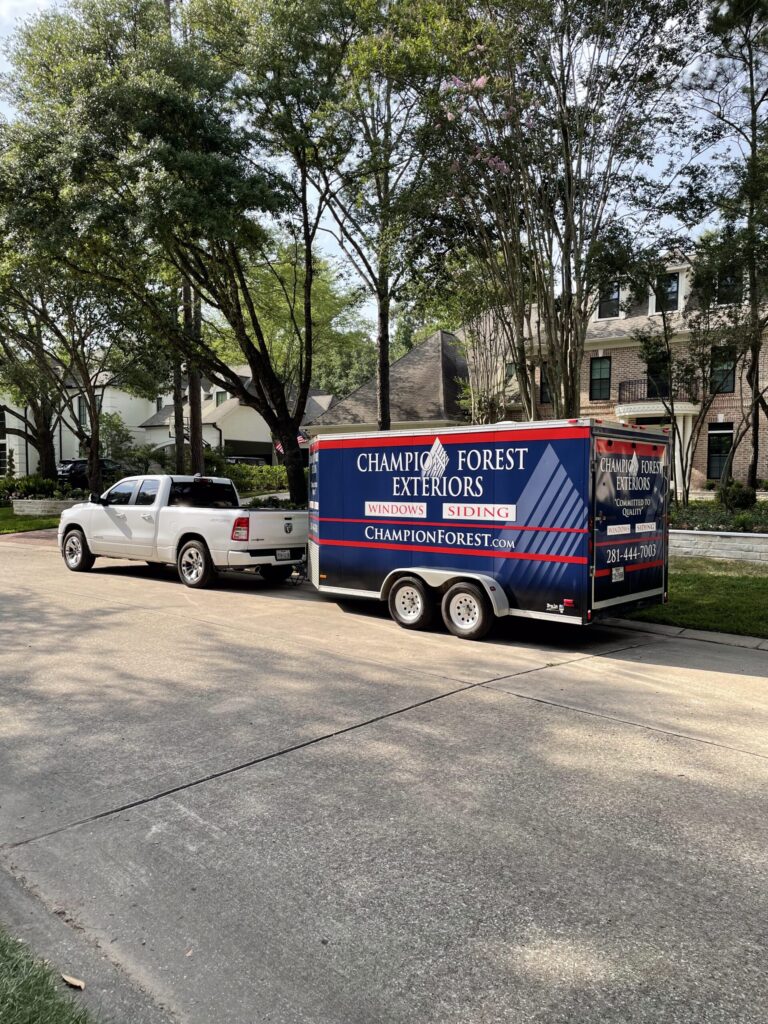 Completed exterior remodeling project by Champion Forest Exteriors in Tomball Texas featuring new siding windows and roofing.