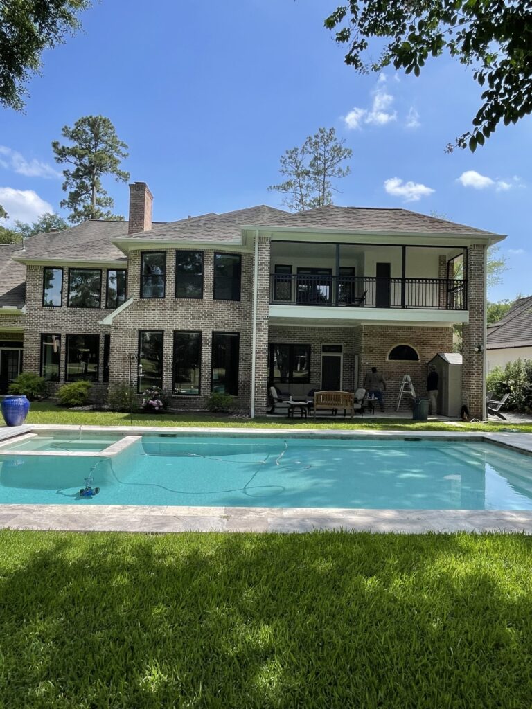 Champion Forest Exteriors team installing durable siding and energy efficient windows tailored to Houston’s climate and style.