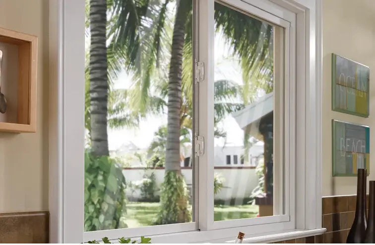 Champion Forest Exteriors installing moisture-resistant siding and windows designed to protect homes in humid and rainy Gulf Coast climates.