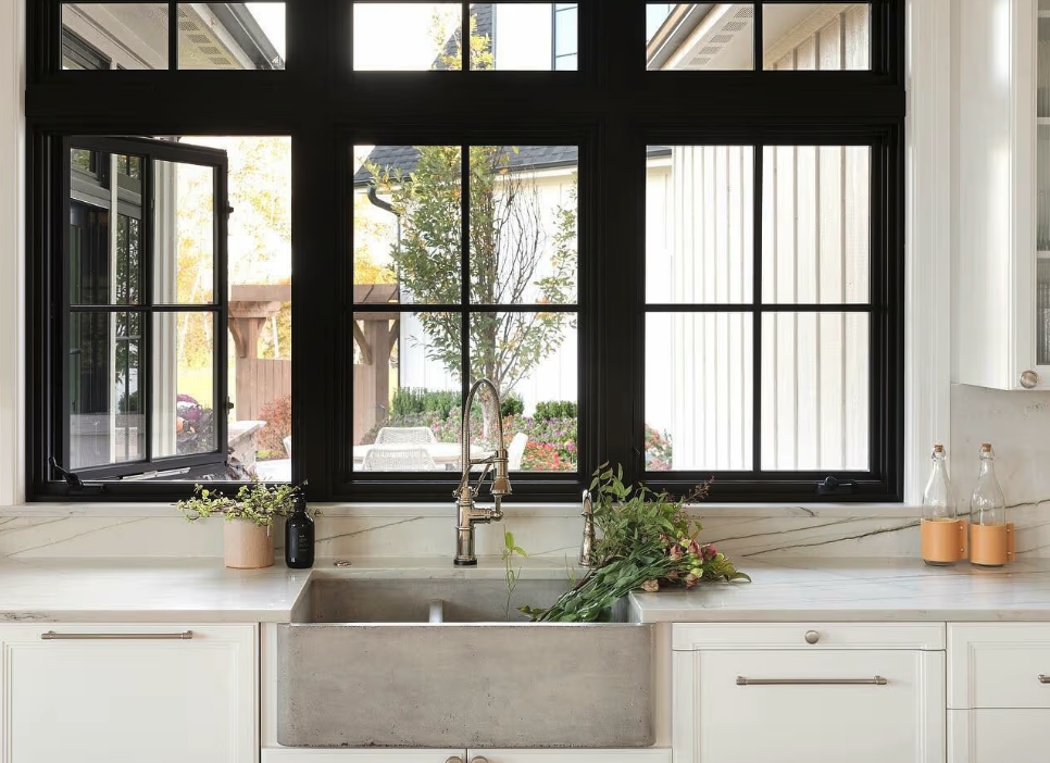 Champion Forest Exteriors vehicles and crew at a completed Houston area home symbolizing trusted exterior remodeling service since 1981.