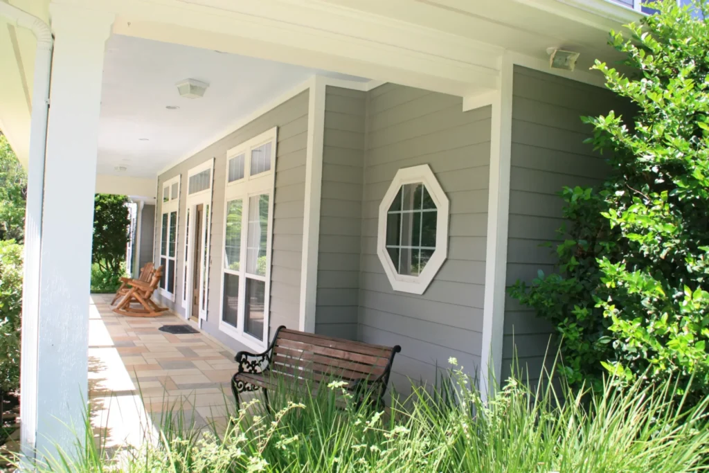 Champion Forest Exteriors team completing a siding installation backed by manufacturer warranty and professional workmanship guarantees.