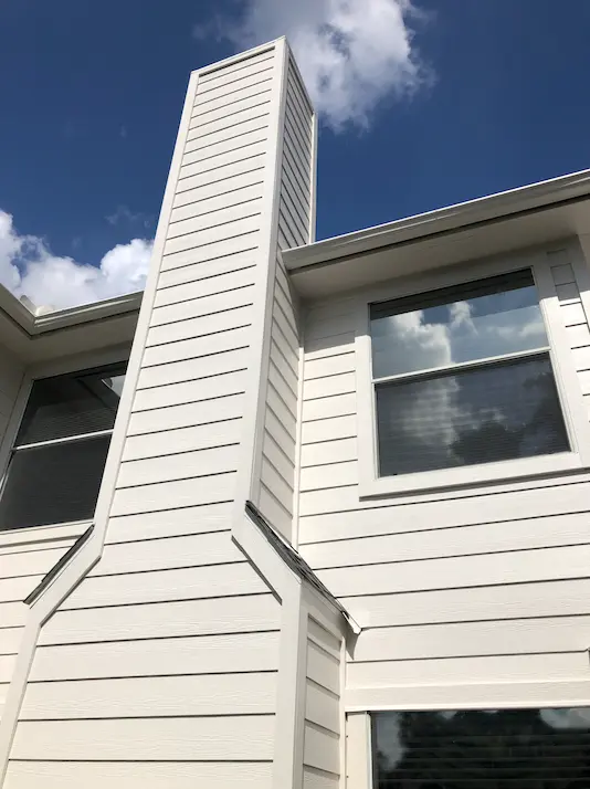 Close-up of James Hardie fiber cement siding installed on a residential home by Champion Forest Exteriors showing its clean lines and durable finish.