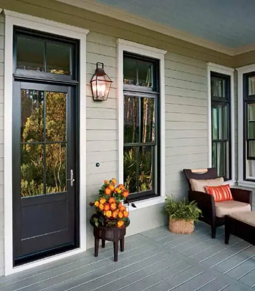 Champion Forest Exteriors consultant meeting with a homeowner to discuss project plans, products, and next steps with professionalism and care.