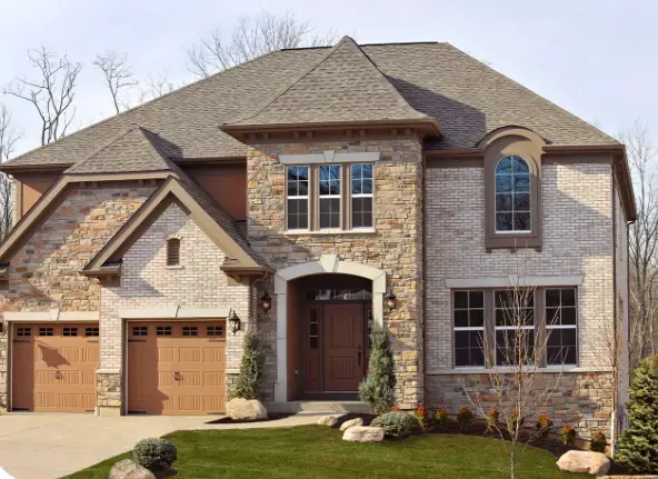 Champion Forest Exteriors completed exterior renovation on a home in Tomball Texas featuring new siding roofing and windows installed with expert care.