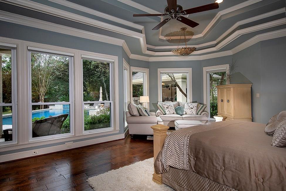 Champion Forest Exteriors installing energy-efficient vinyl windows on a Houston home showcasing low maintenance and climate durability.