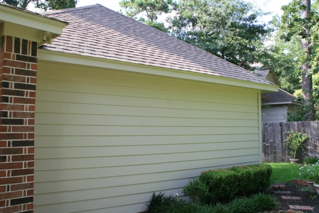 Champion Forest Exteriors installing HardiePlank lap siding on a residential home highlighting its classic look and durable construction.